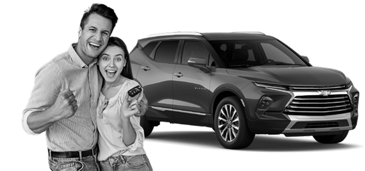 Happy couple holding car keys beside a modern SUV, expressing excitement and satisfaction.