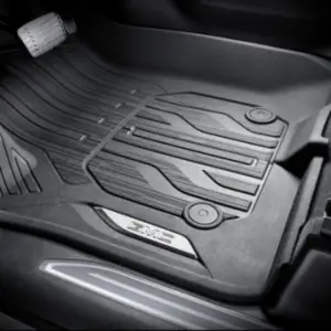 Genuine GM moulded black floor liner in the driver footwell of a truck